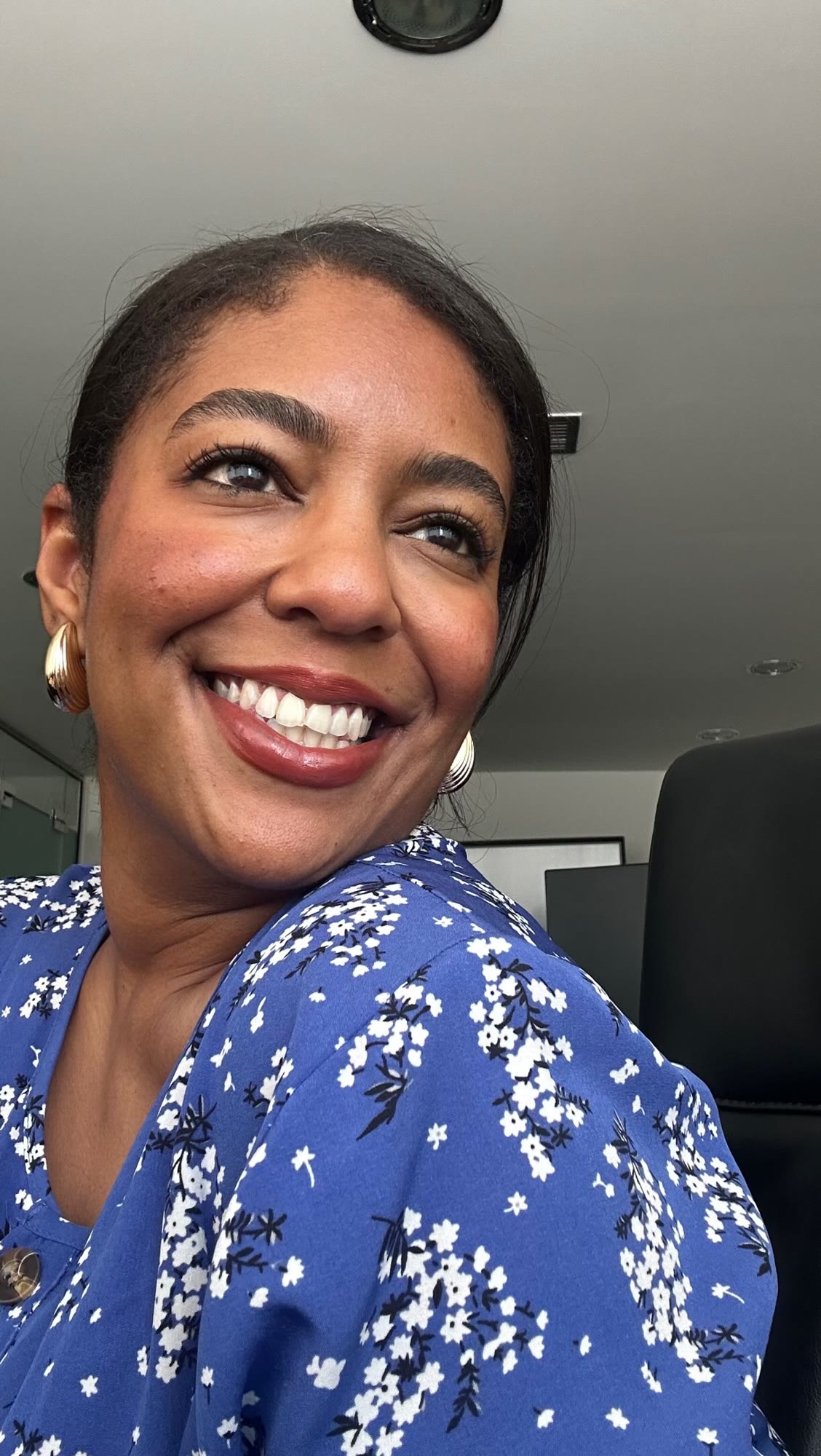 Asma smiling in blue florals